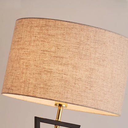 Lampadaire moderne en métal noir avec abat-jour cylindrique