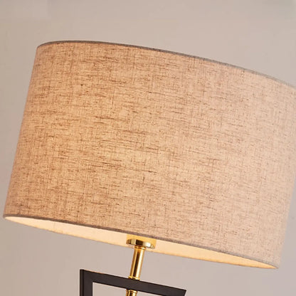 Lampadaire moderne en métal noir avec abat-jour cylindrique
