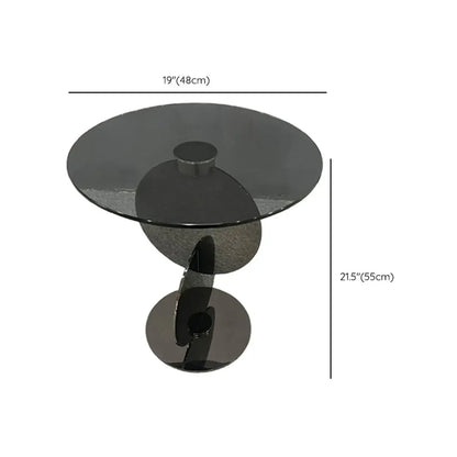 Table basse ronde en verre de style scandinave avec piètement abstrait