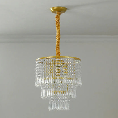 Lustre rond moderne en cristal doré à suspension descendante