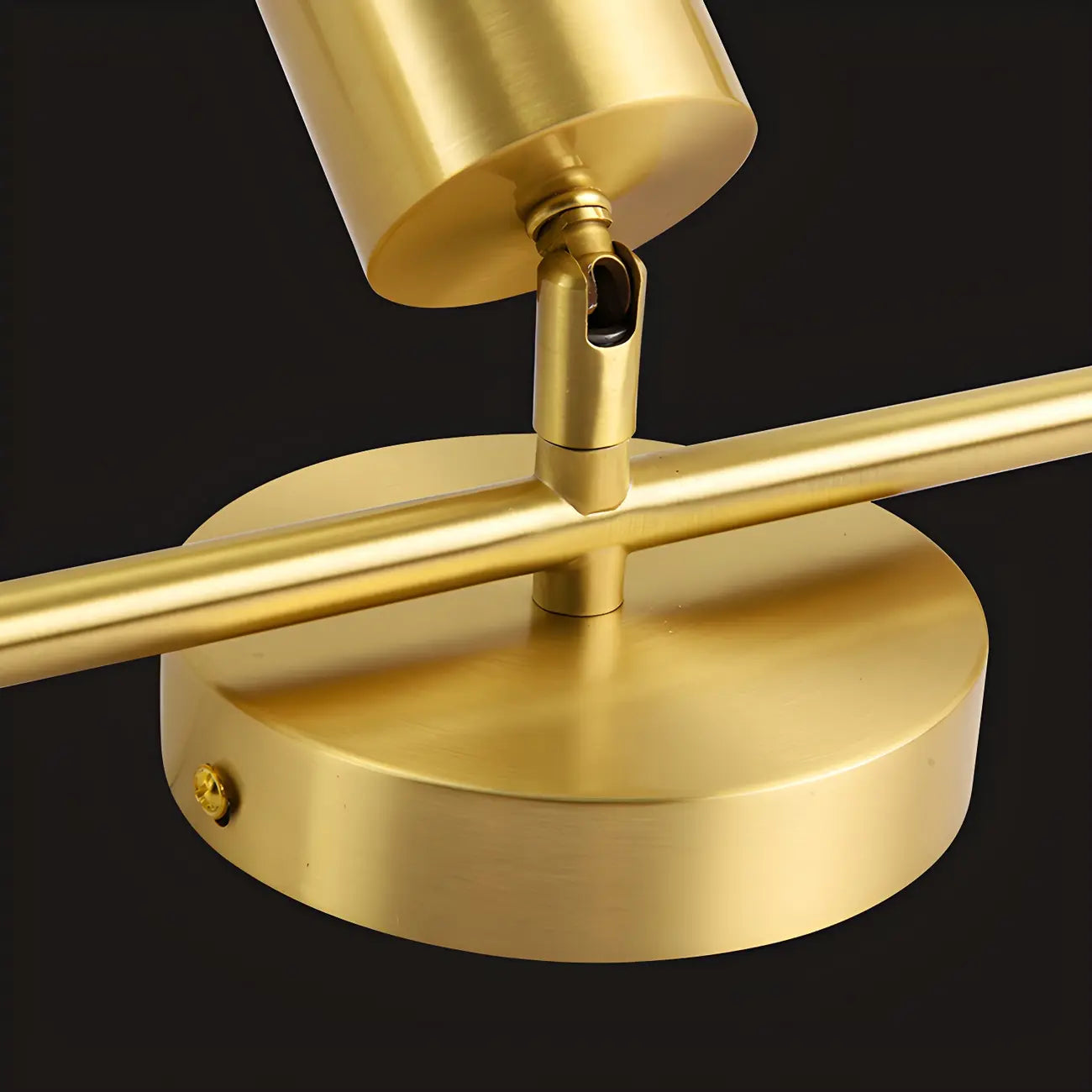 4 spots lumineux dorés sur rail avec têtes orientables