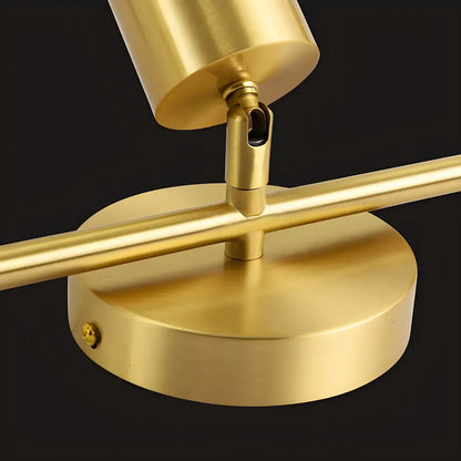 4 spots lumineux dorés sur rail avec têtes orientables